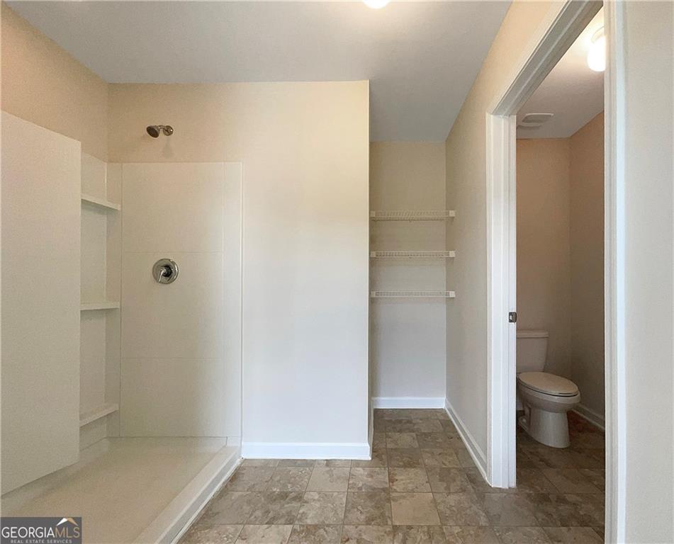 1033 Eldon Lane Fairburn, GA 30213 - Photo 20 of 21 a bathroom with a shower