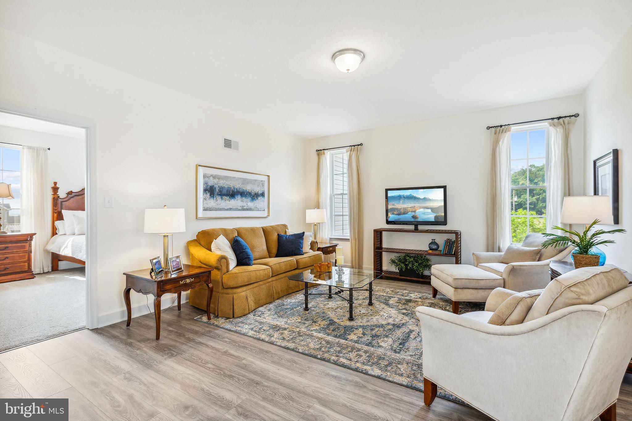 185 East Audubon Drive, Unit 177 Gettysburg, PA 17325 - Photo 16 of 36 a living room with furniture and a flat screen tv