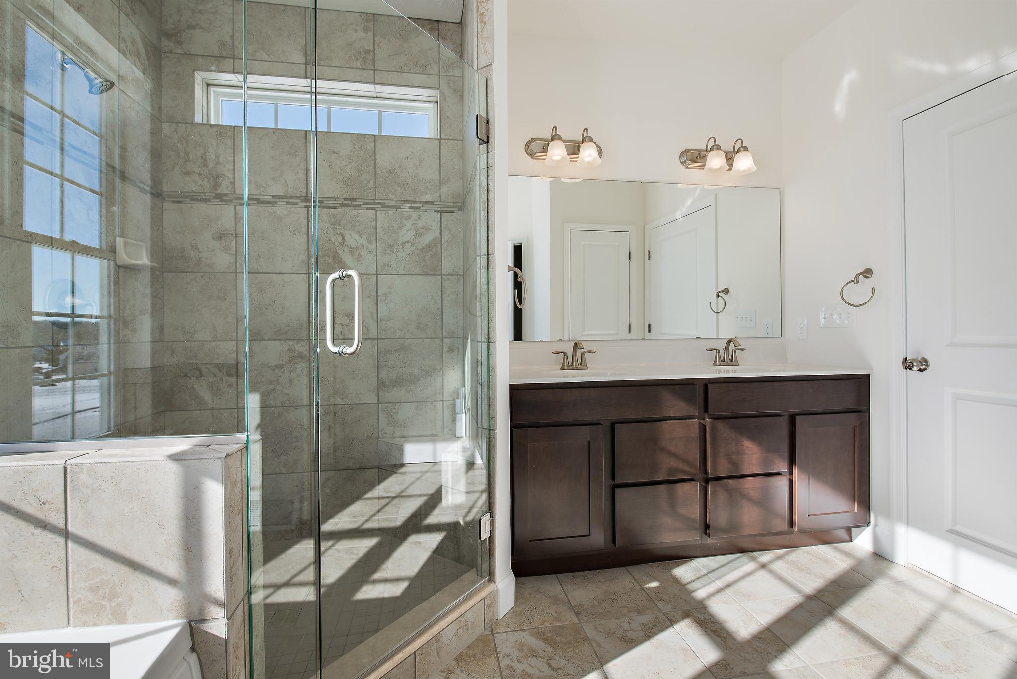 185 East Audubon Drive, Unit 177 Gettysburg, PA 17325 - Photo 20 of 36 a bathroom with a sink a toilet and shower