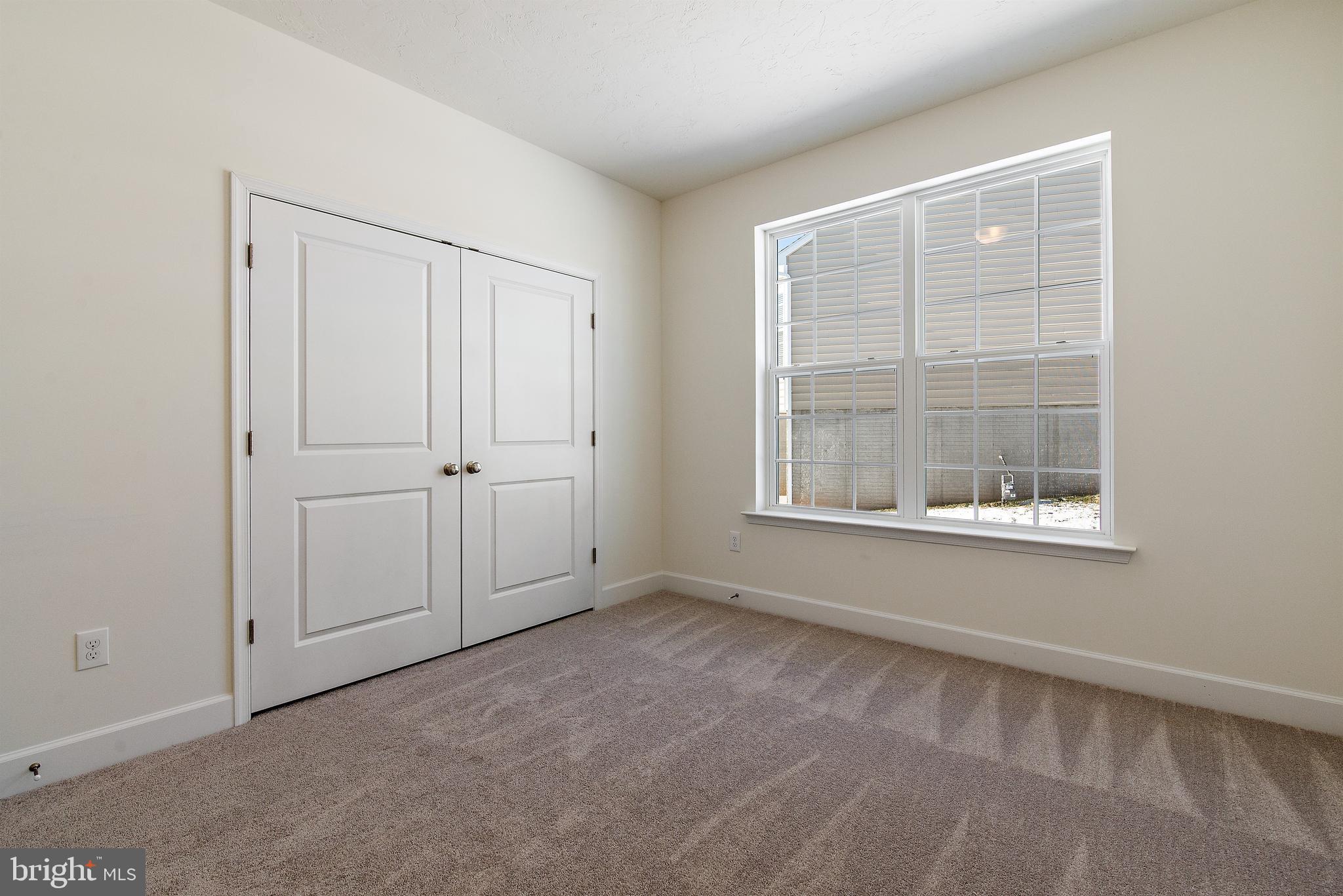 185 East Audubon Drive, Unit 177 Gettysburg, PA 17325 - Photo 21 of 36 an empty room with windows