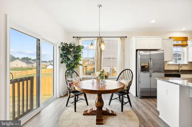 a bedroom with a bed and a potted plant