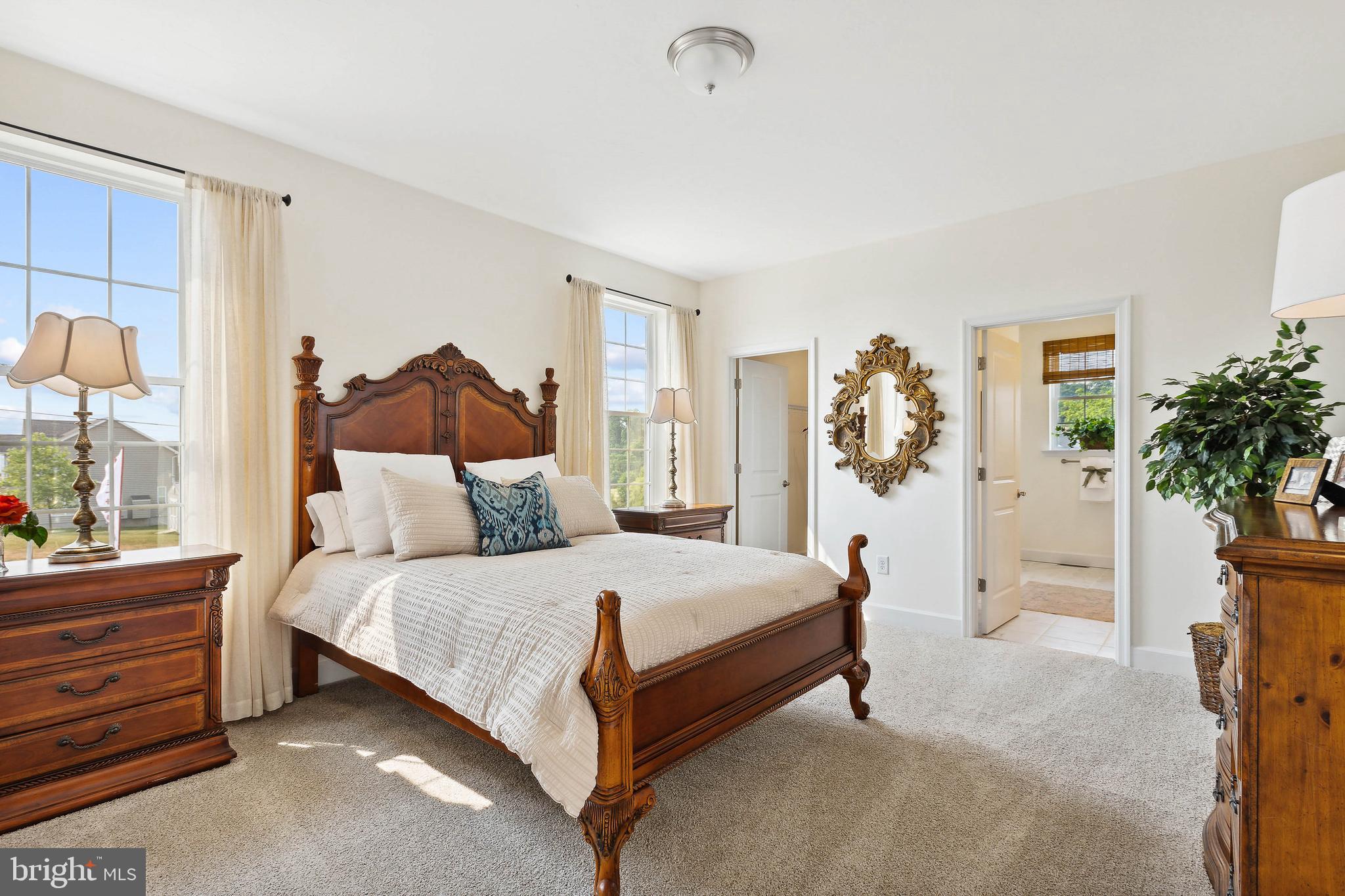 185 East Audubon Drive, Unit 177 Gettysburg, PA 17325 - Photo 26 of 36 a bedroom with a bed and a potted plant
