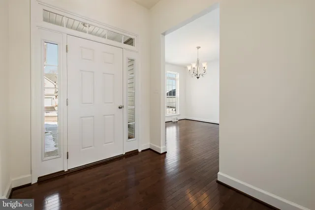 an empty room with wooden floor