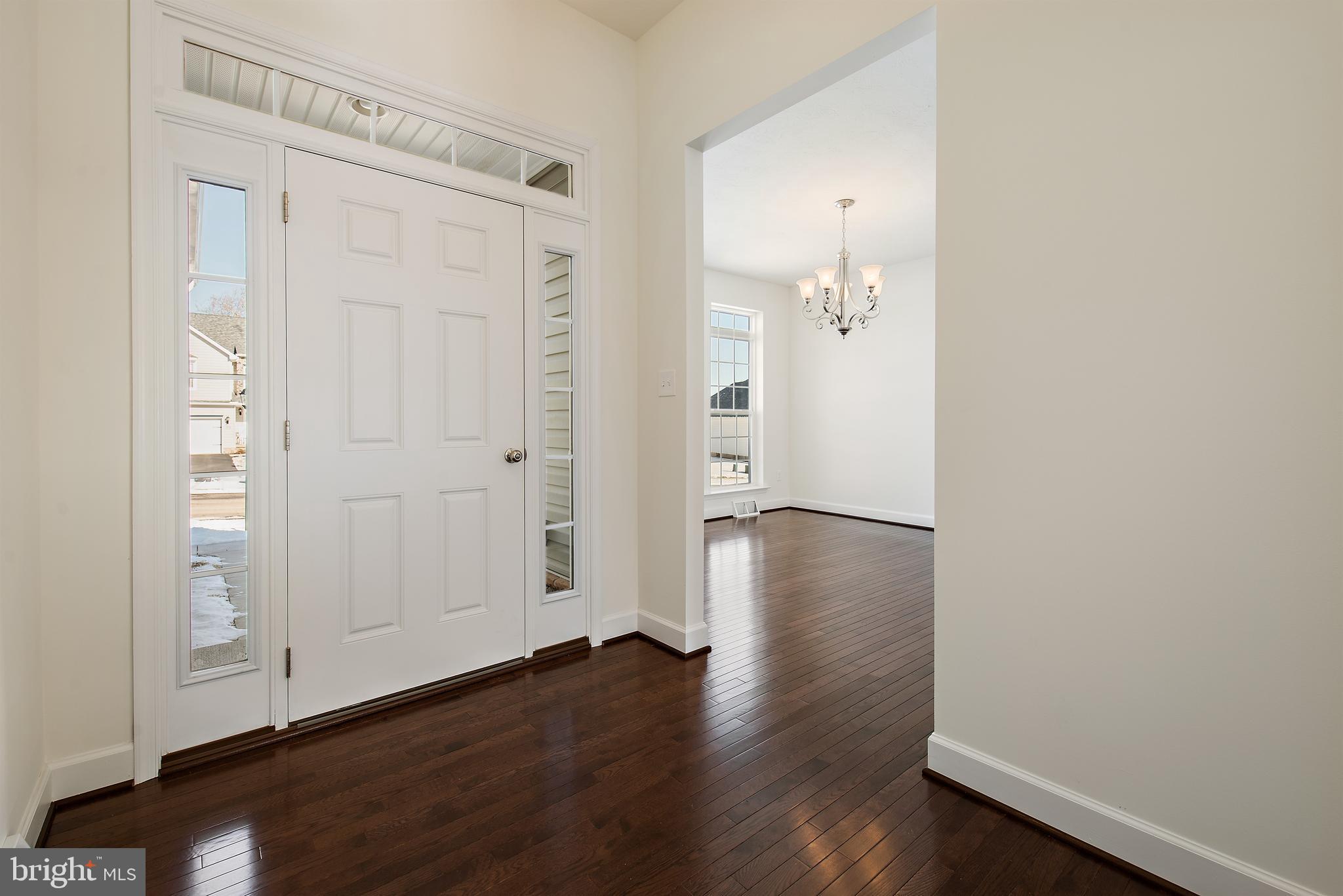 185 East Audubon Drive, Unit 177 Gettysburg, PA 17325 - Photo 3 of 36 an empty room with wooden floor