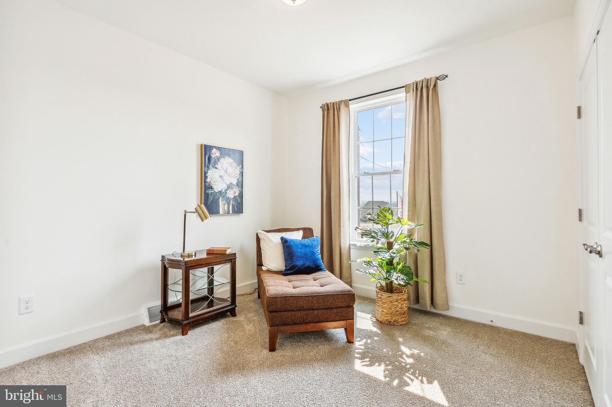 185 East Audubon Drive, Unit 177 Gettysburg, PA 17325 - Photo 31 of 36 a bedroom with furniture and a window