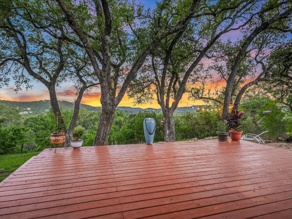 Stunning single-story sanctuary just moments away from the picturesque shores of Lake Travis, offering breathtaking hill country vistas and enchanting sunset views.
