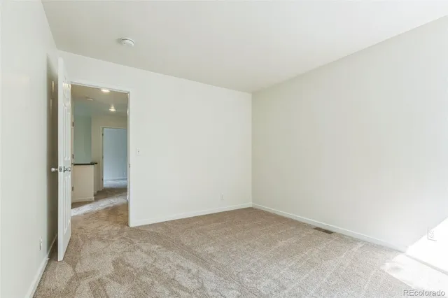 an empty room with a bathroom