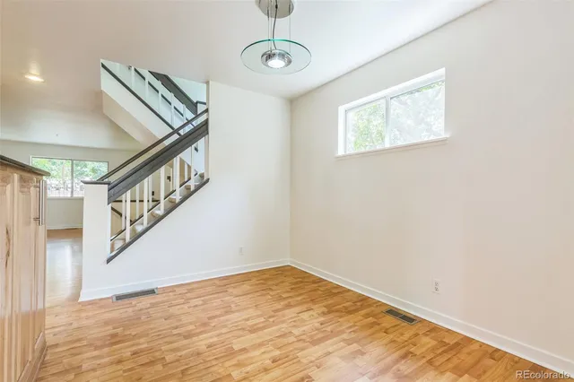 a view of an entryway with wooden floor