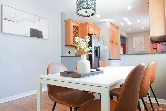 a dining room with furniture and window