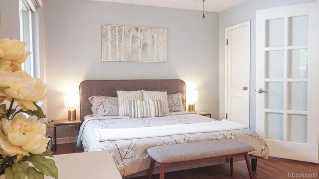 a bed room with a bed and a chair