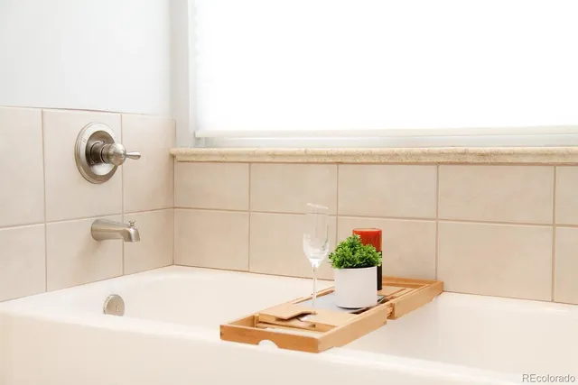 a bathroom with a tub and sink