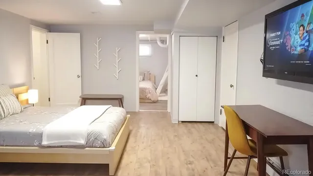 a bedroom with a bed and a table