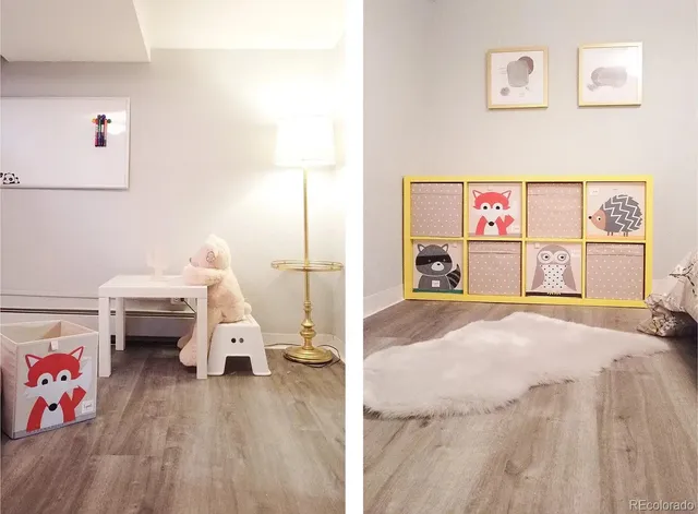 a view of a bedroom with toys and flat screen tv