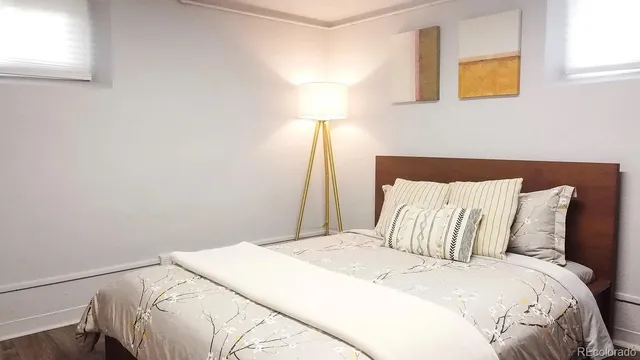 a bedroom with a bed and a dresser