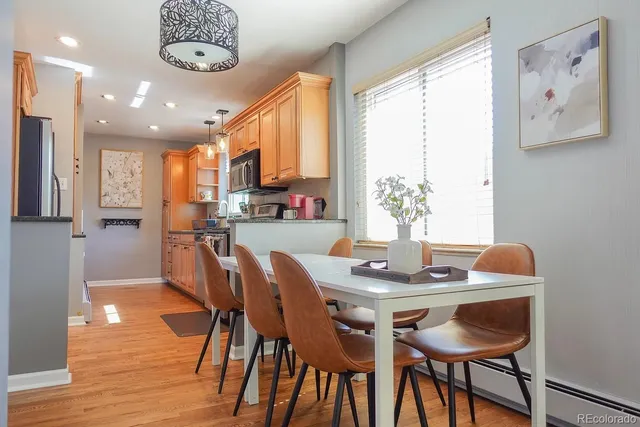a view of a dining room with furniture window and wooden floor