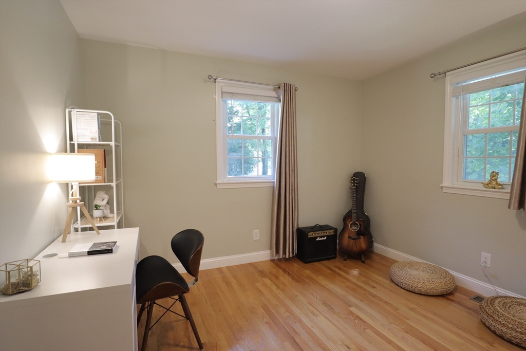 838 Worcester Street Wellesley, MA 02482 - Photo 23 of 42 a bedroom with a bed and a window