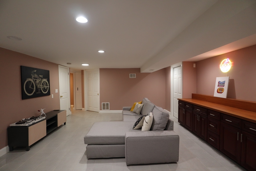 838 Worcester Street Wellesley, MA 02482 - Photo 26 of 42 a living room with furniture and a flat screen tv