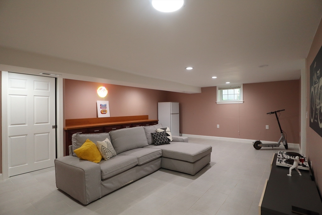 838 Worcester Street Wellesley, MA 02482 - Photo 27 of 42 a living room with furniture and a couch