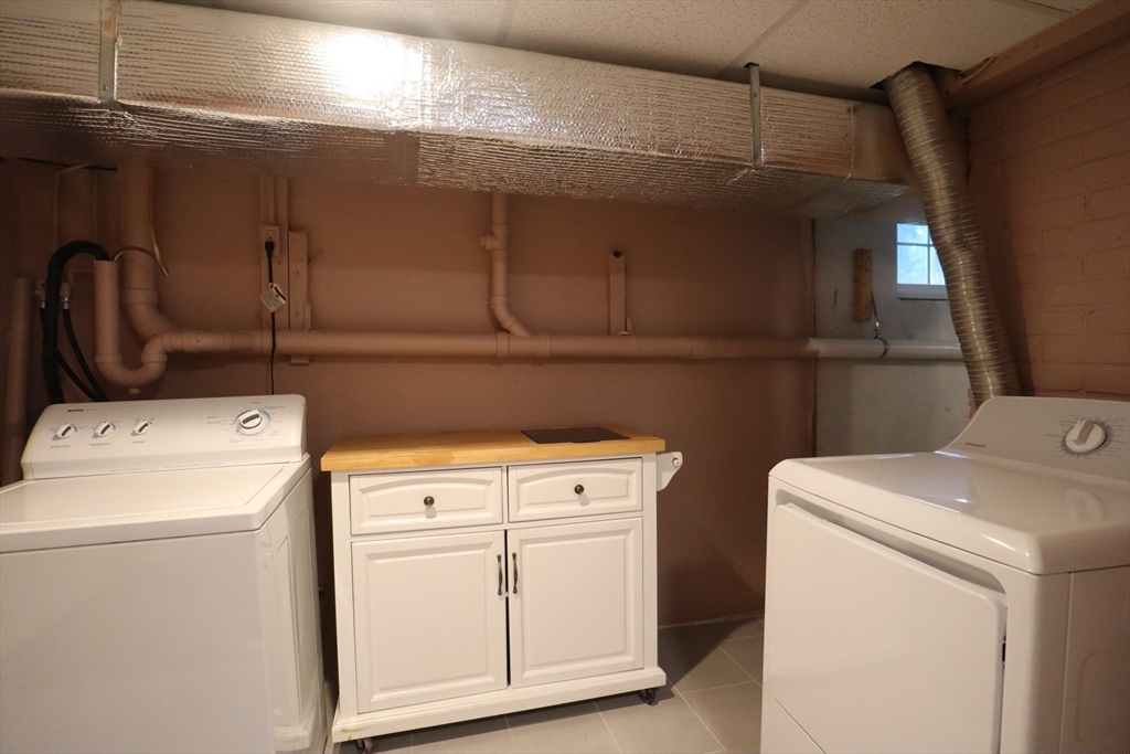 838 Worcester Street Wellesley, MA 02482 - Photo 32 of 42 a utility room with dryer and washer