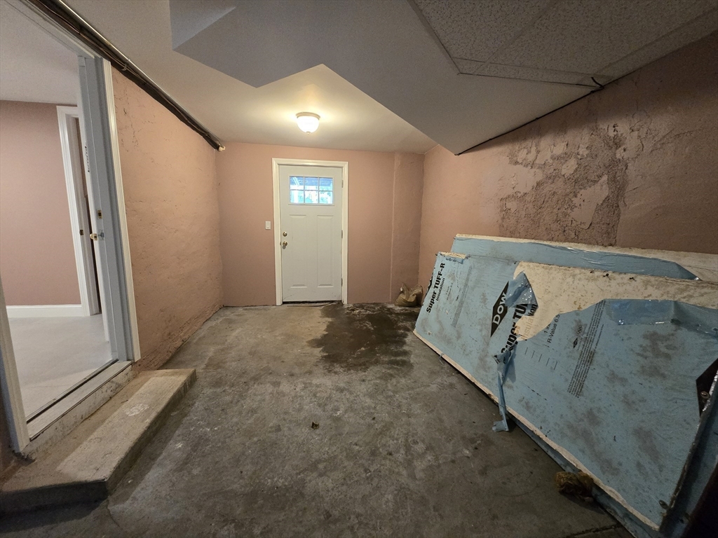 838 Worcester Street Wellesley, MA 02482 - Photo 35 of 42 a bed sitting in a spacious bedroom next to a window