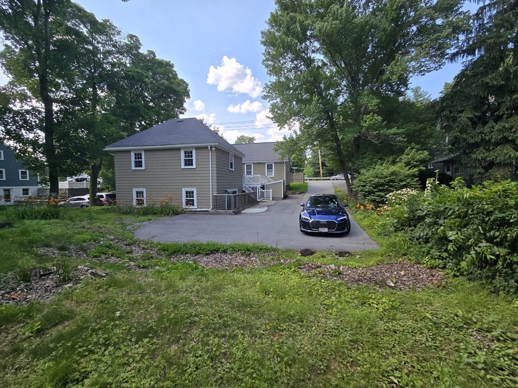 838 Worcester Street Wellesley, MA 02482 - Photo 40 of 42 a house view with a garden space