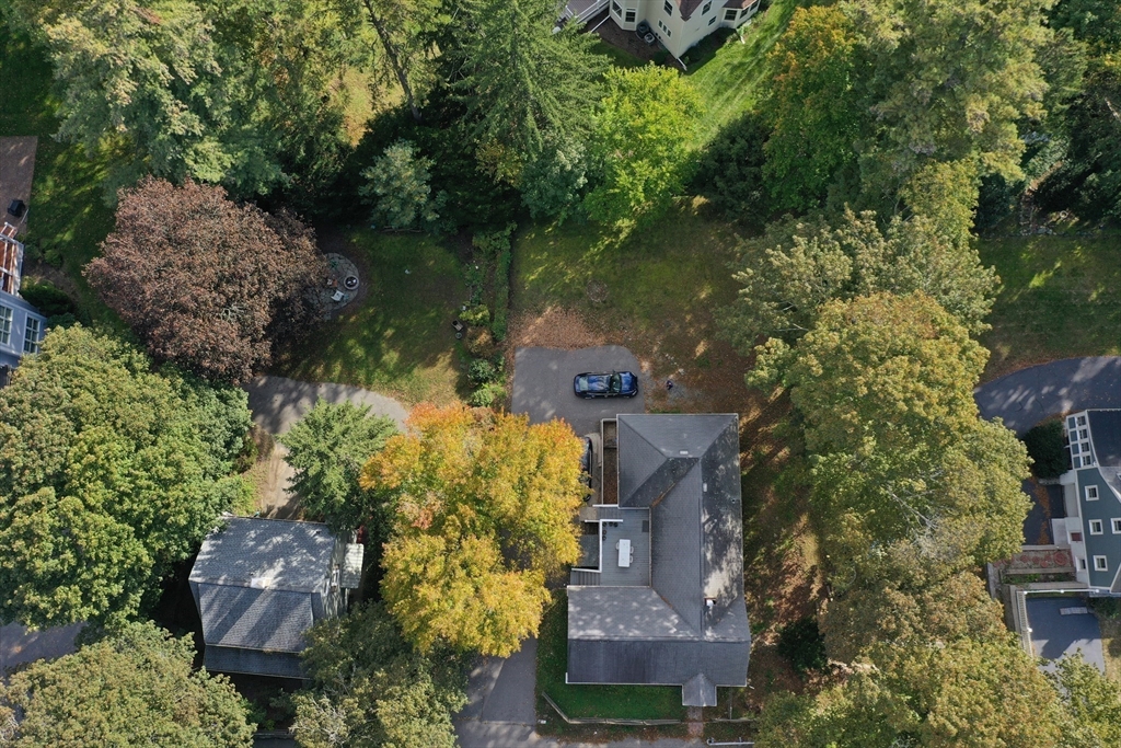 838 Worcester Street Wellesley, MA 02482 - Photo 42 of 42 an aerial view of a house with a yard