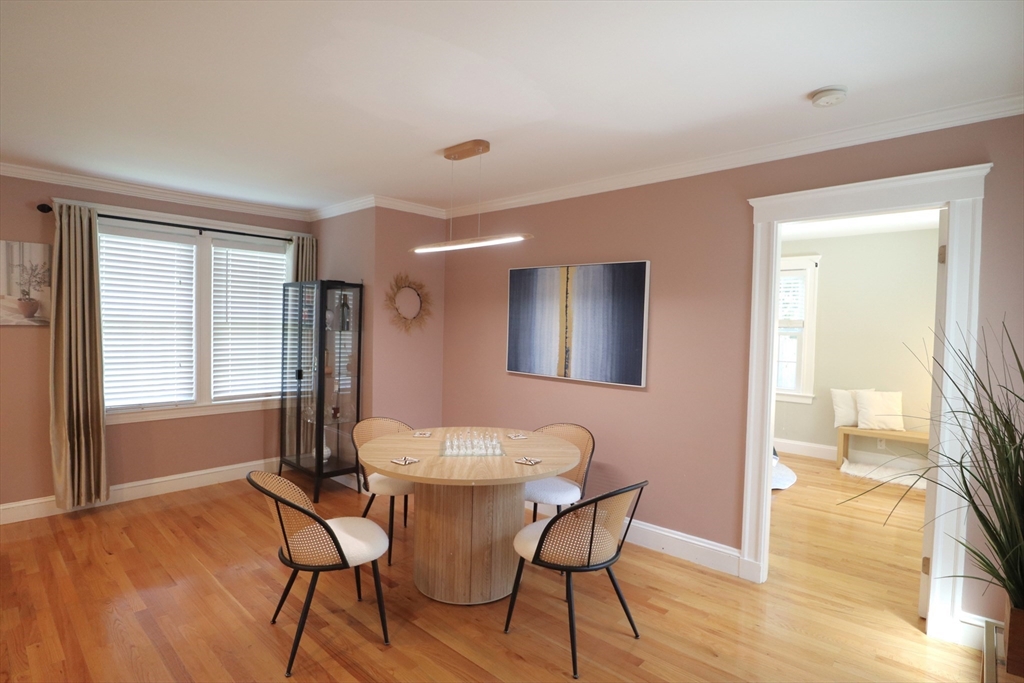 838 Worcester Street Wellesley, MA 02482 - Photo 9 of 42 a dining room with furniture and wooden floor
