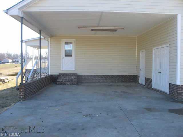 3957 Jimmy Bowles Road Elon, NC 27244 - Photo 4 of 6 Other. Carport with Built In Storage