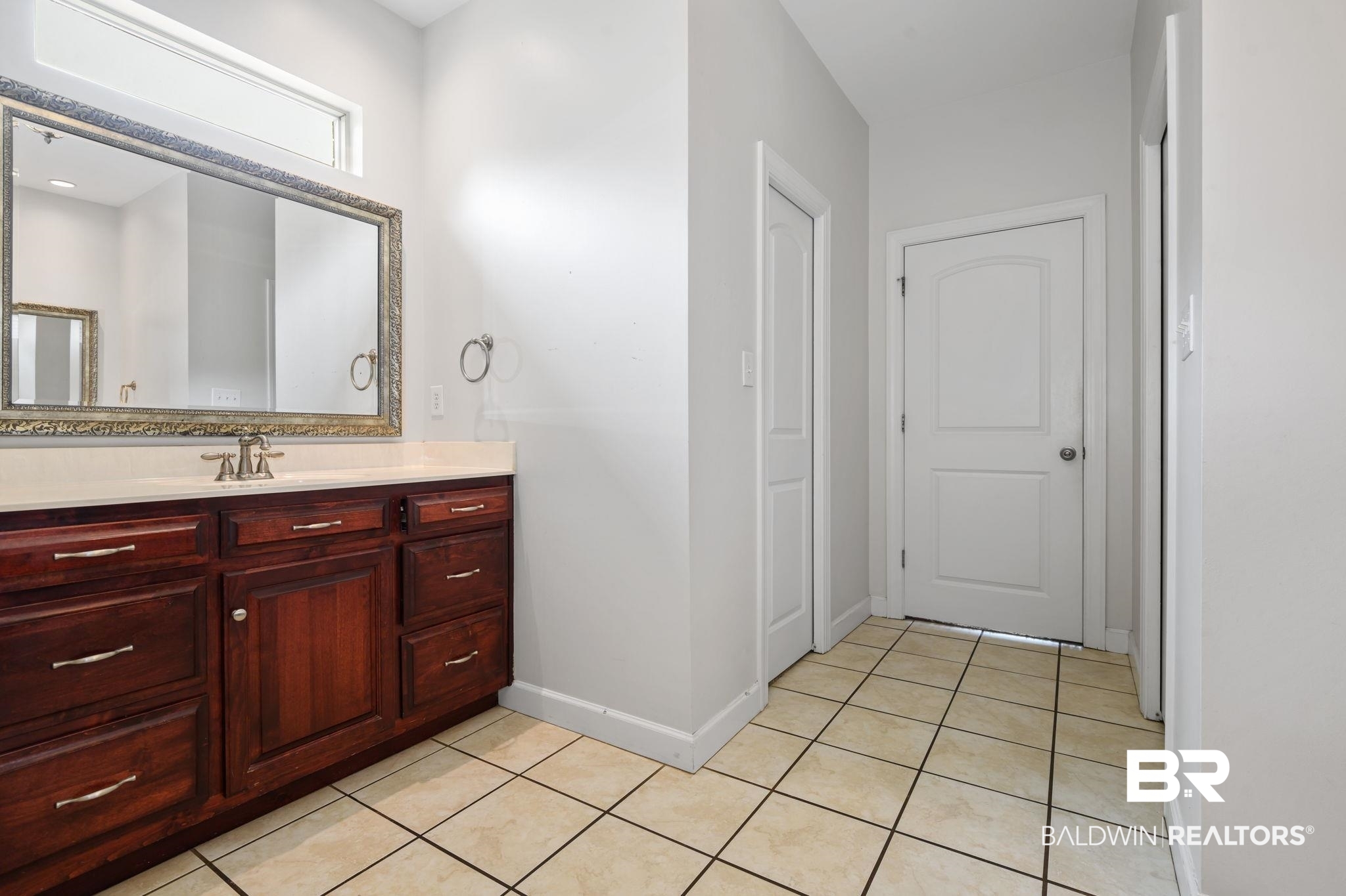 9730 Harmony Ridge Circle West Semmes, AL 36575 - Photo 17 of 38 Bathroom featuring vanity, tile patterned flooring, and baseboards