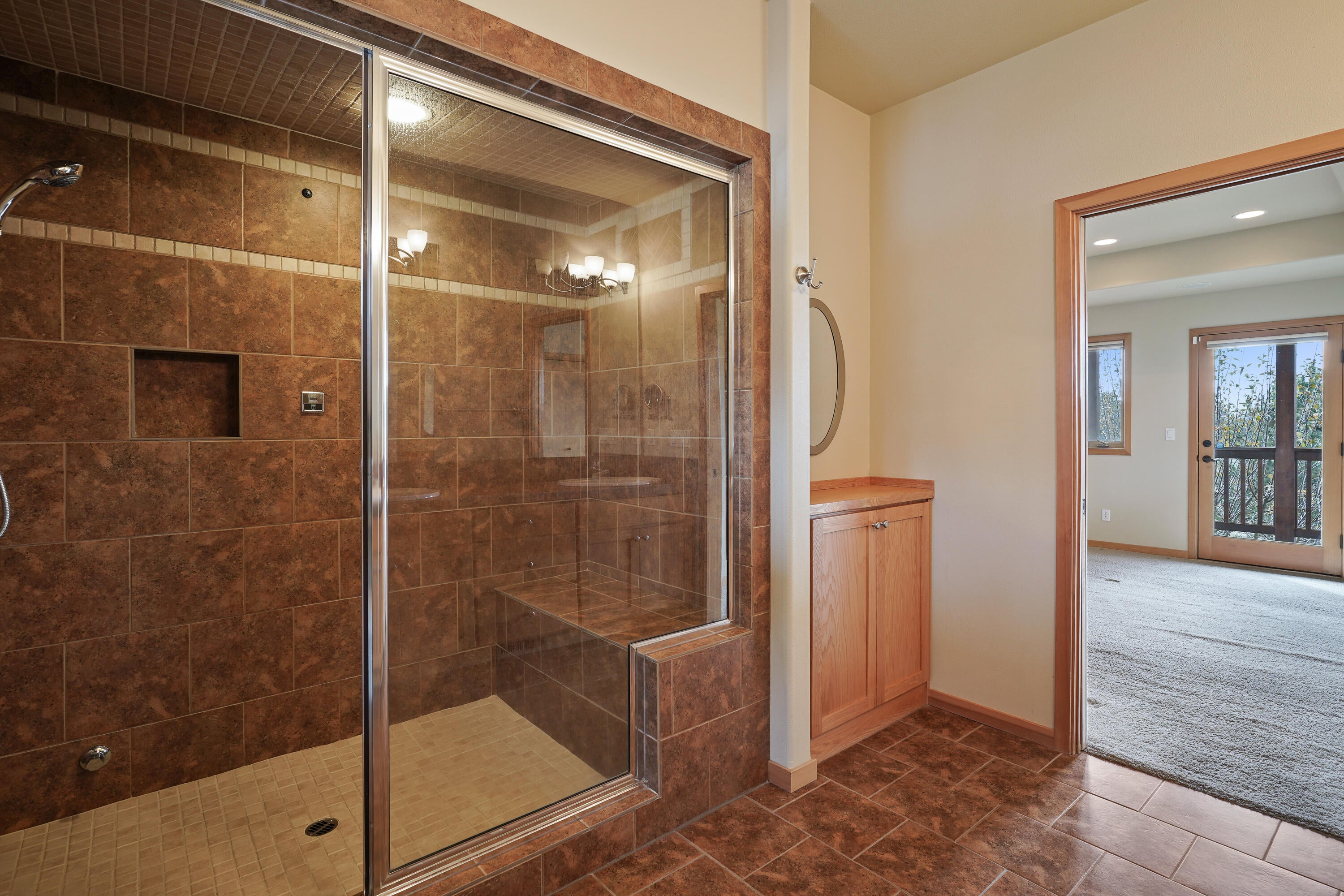 8578 Southwest Shad Road Terrebonne, OR 97760 - Photo 20 of 42 Additional storage cabinet in primary bathroom to right of shower