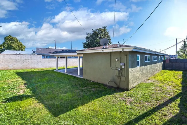 a view of a backyard with sitting area