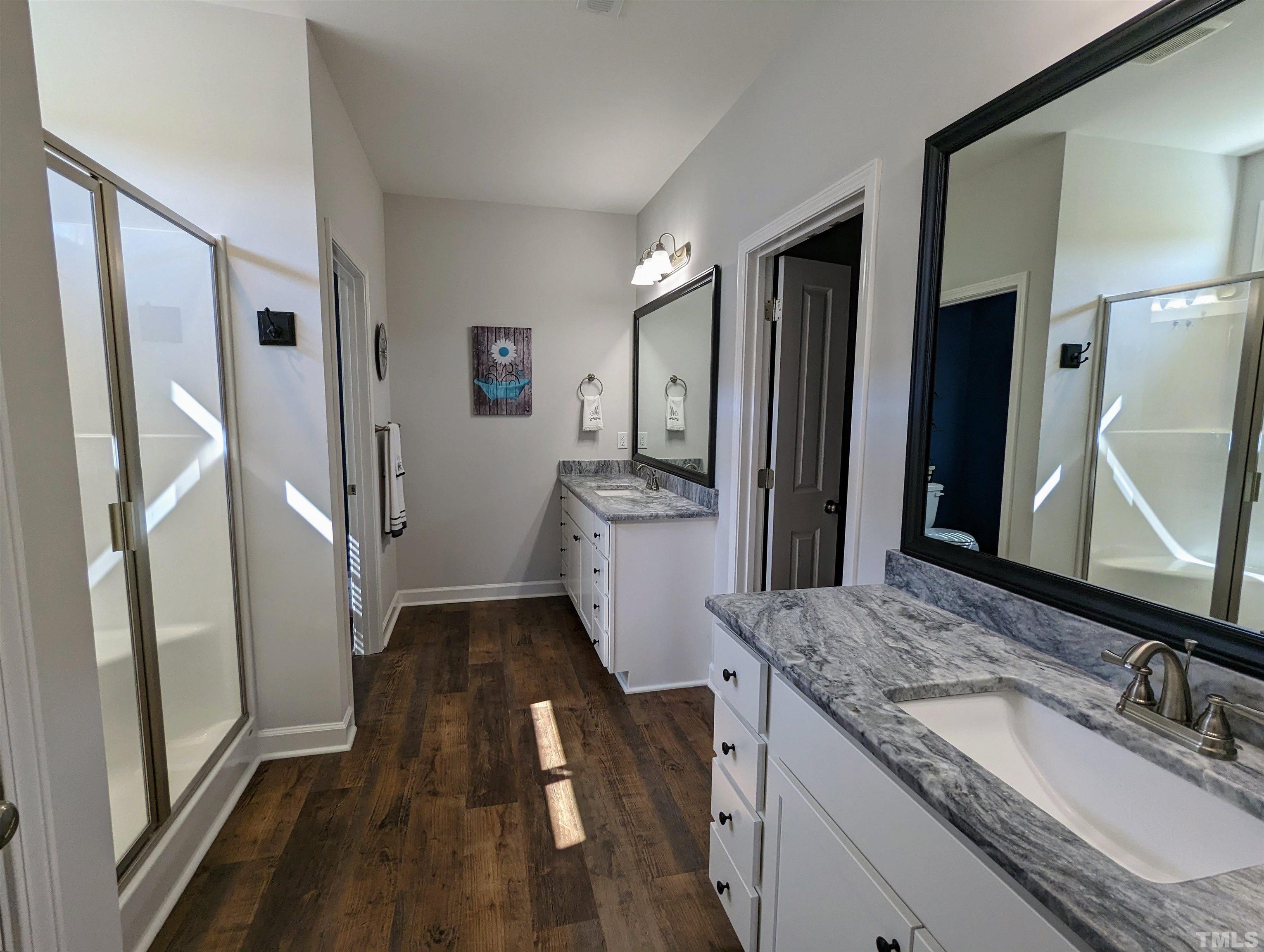 630 Ballance Road Fremont, NC 27830 - Photo 13 of 35 a bathroom with a granite countertop sink and a mirror