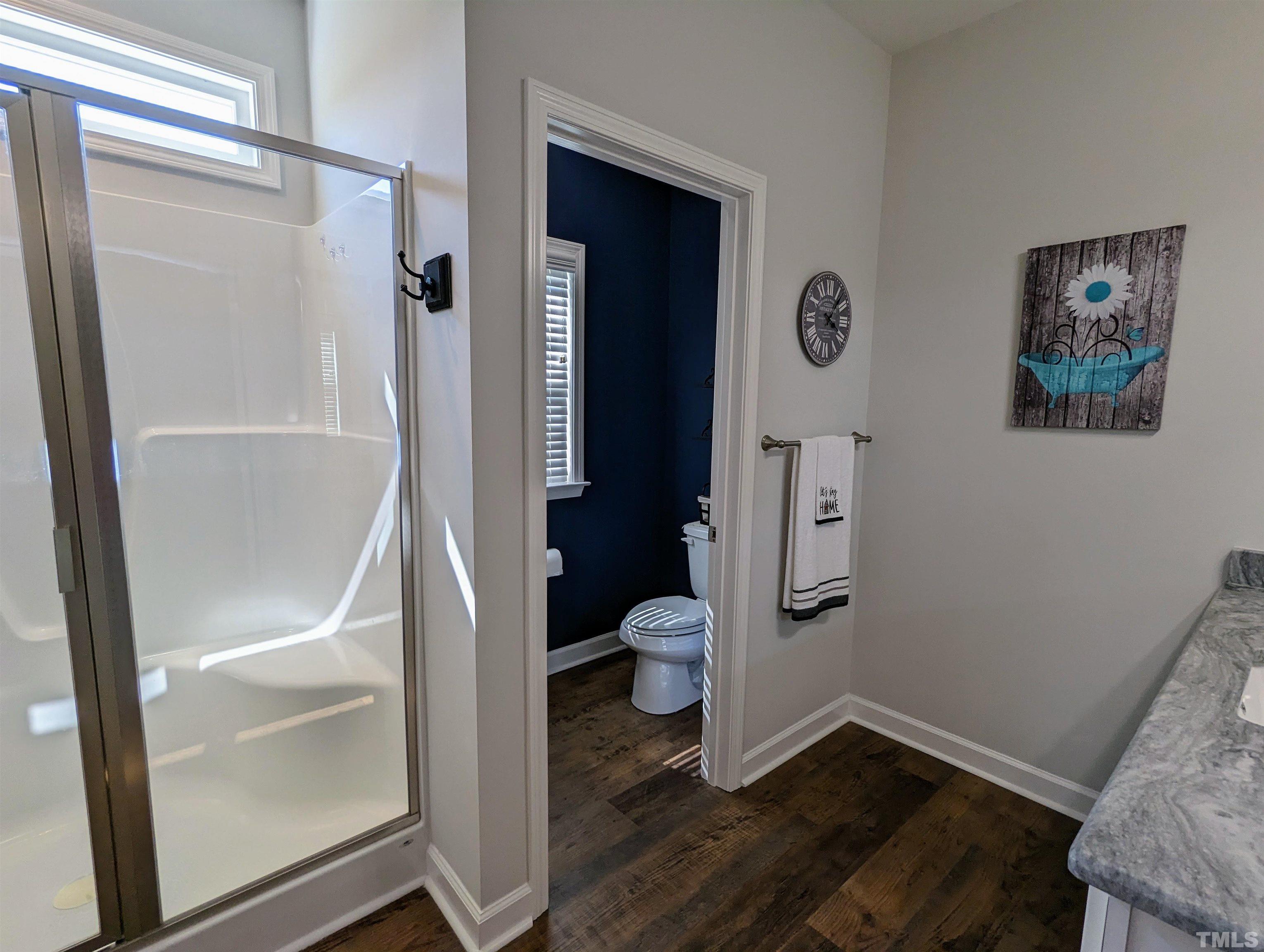 630 Ballance Road Fremont, NC 27830 - Photo 14 of 35 a bathroom with a glass door shower and toilet