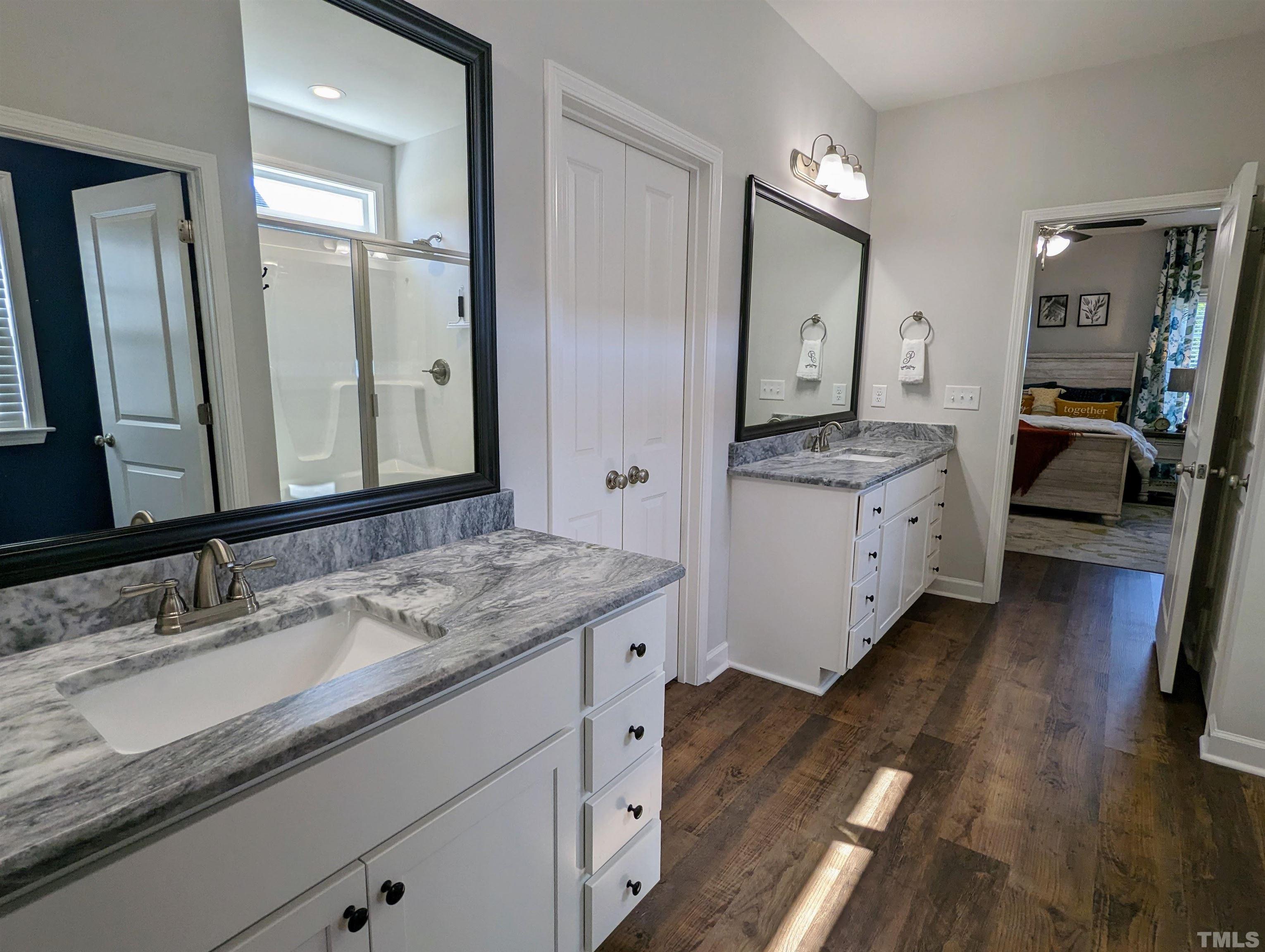 630 Ballance Road Fremont, NC 27830 - Photo 16 of 35 a en suite bathroom with a granite countertop double vanity sink and a mirror