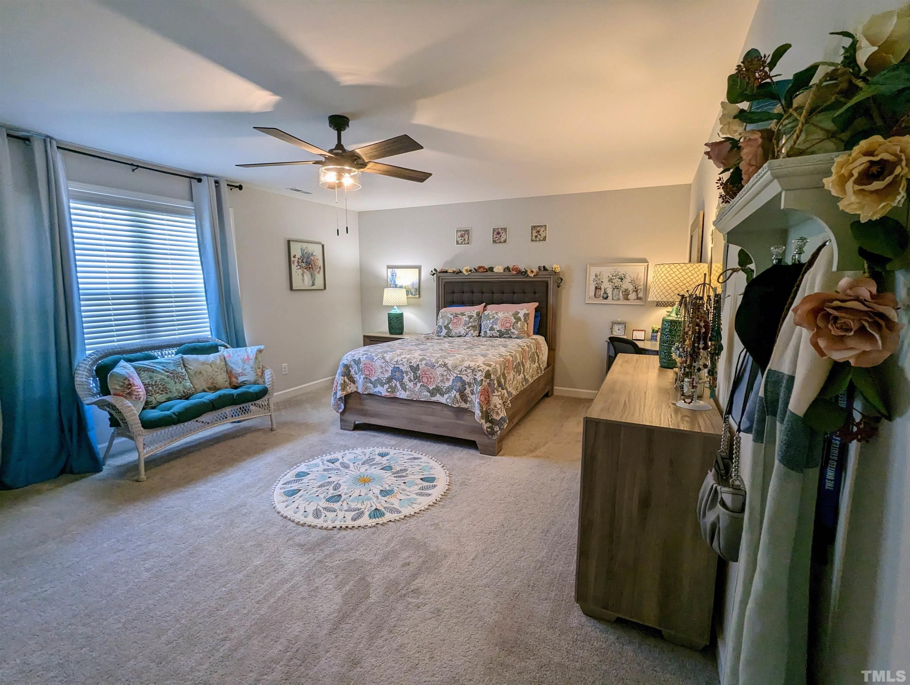 630 Ballance Road Fremont, NC 27830 - Photo 21 of 35 a bedroom with furniture and a chandelier