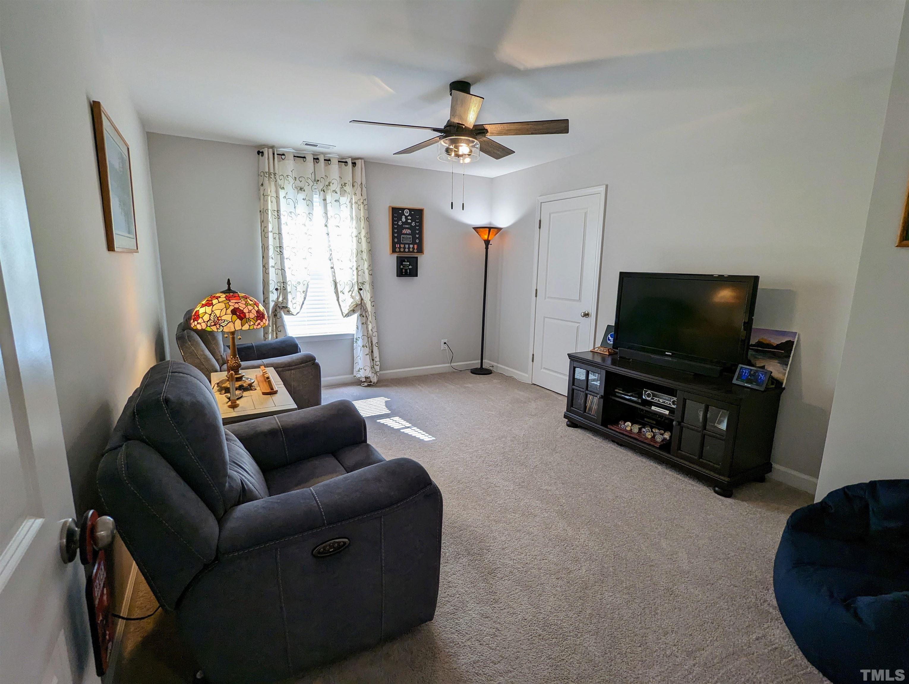 630 Ballance Road Fremont, NC 27830 - Photo 27 of 35 a living room with furniture and a flat screen tv