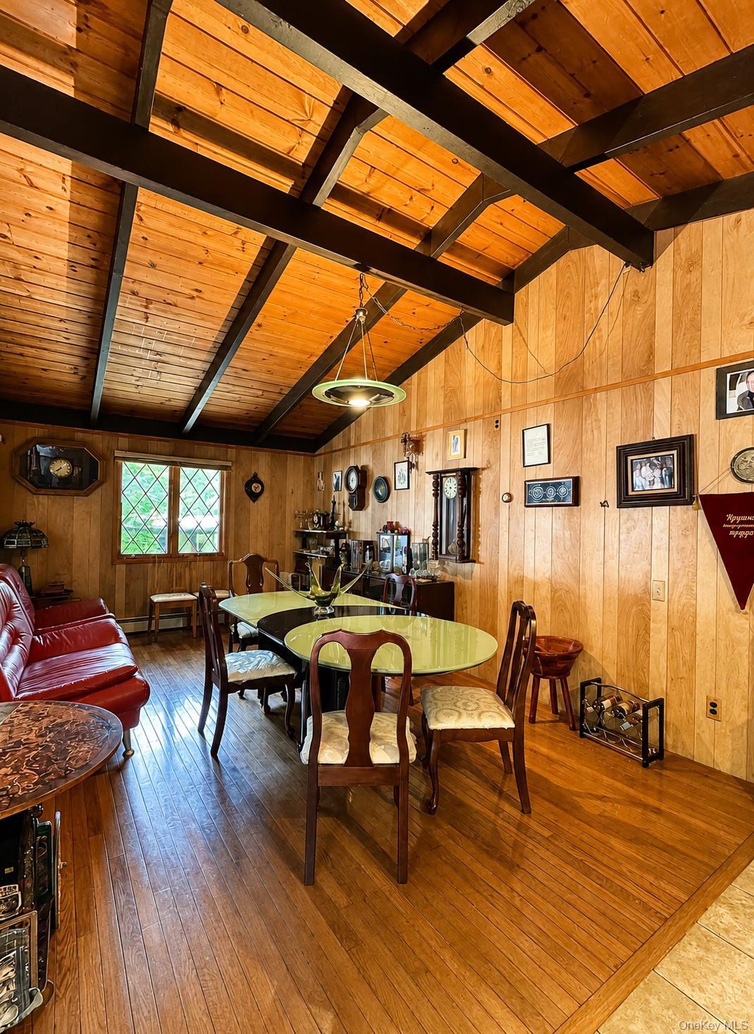 177 Davos Road Woodridge, NY 12789 - Photo 3 of 19 a view of a dining room with furniture window and wooden floor