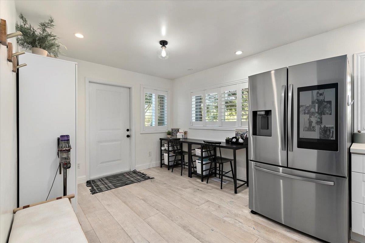 789 Cañada Road Woodside, CA 94062 - Photo 11 of 33 a kitchen with stainless steel appliances granite countertop a refrigerator and a stove top oven
