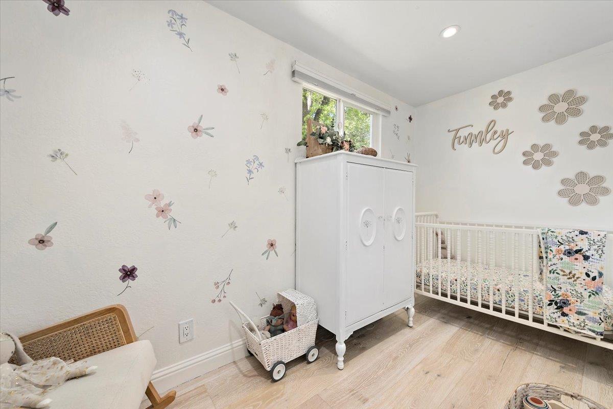 789 Cañada Road Woodside, CA 94062 - Photo 14 of 33 a view of a room with toys and wooden floor