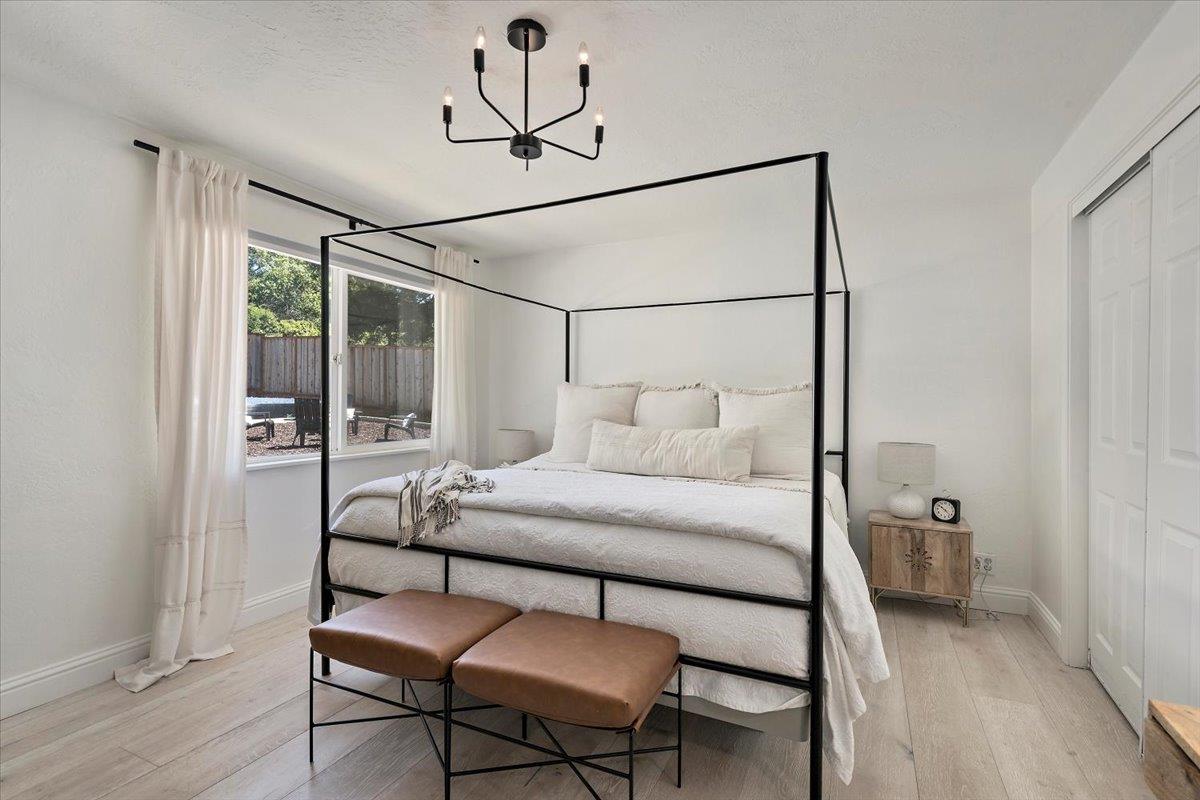 789 Cañada Road Woodside, CA 94062 - Photo 16 of 33 a bedroom with a bed and a mirror