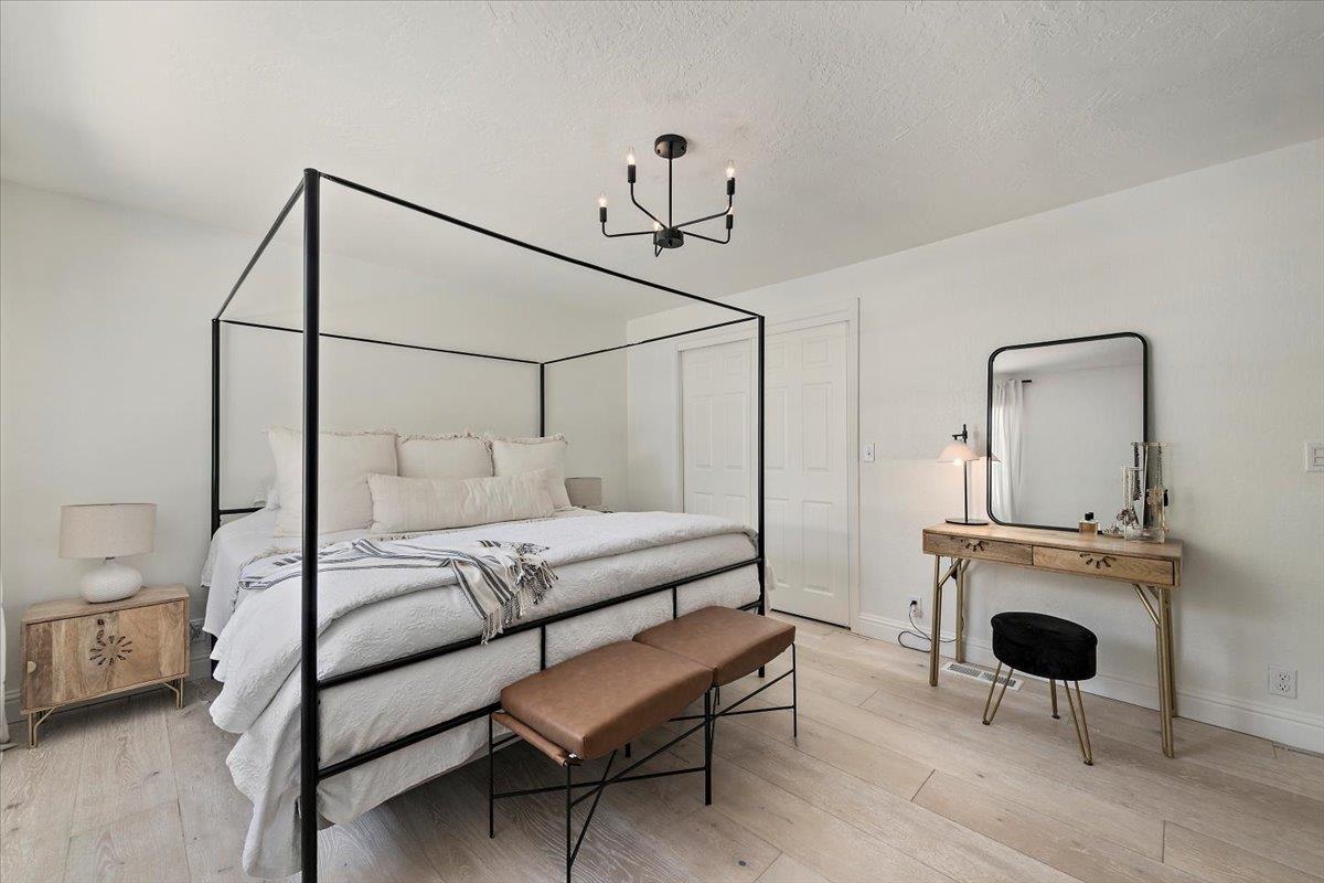 789 Cañada Road Woodside, CA 94062 - Photo 17 of 33 a bedroom with furniture and a mirror