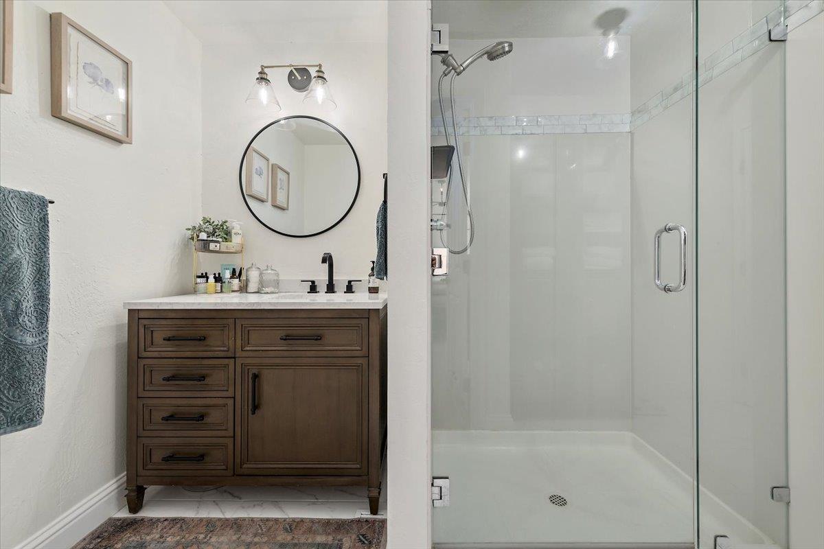 789 Cañada Road Woodside, CA 94062 - Photo 18 of 33 a bathroom with a shower a sink and a mirror
