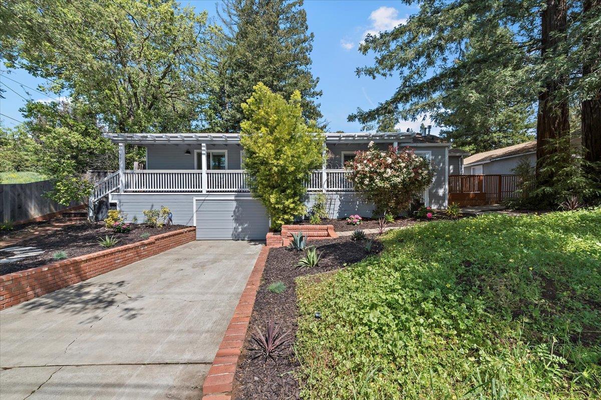 789 Cañada Road Woodside, CA 94062 - Photo 2 of 33 a view of a backyard with sitting area and furniture
