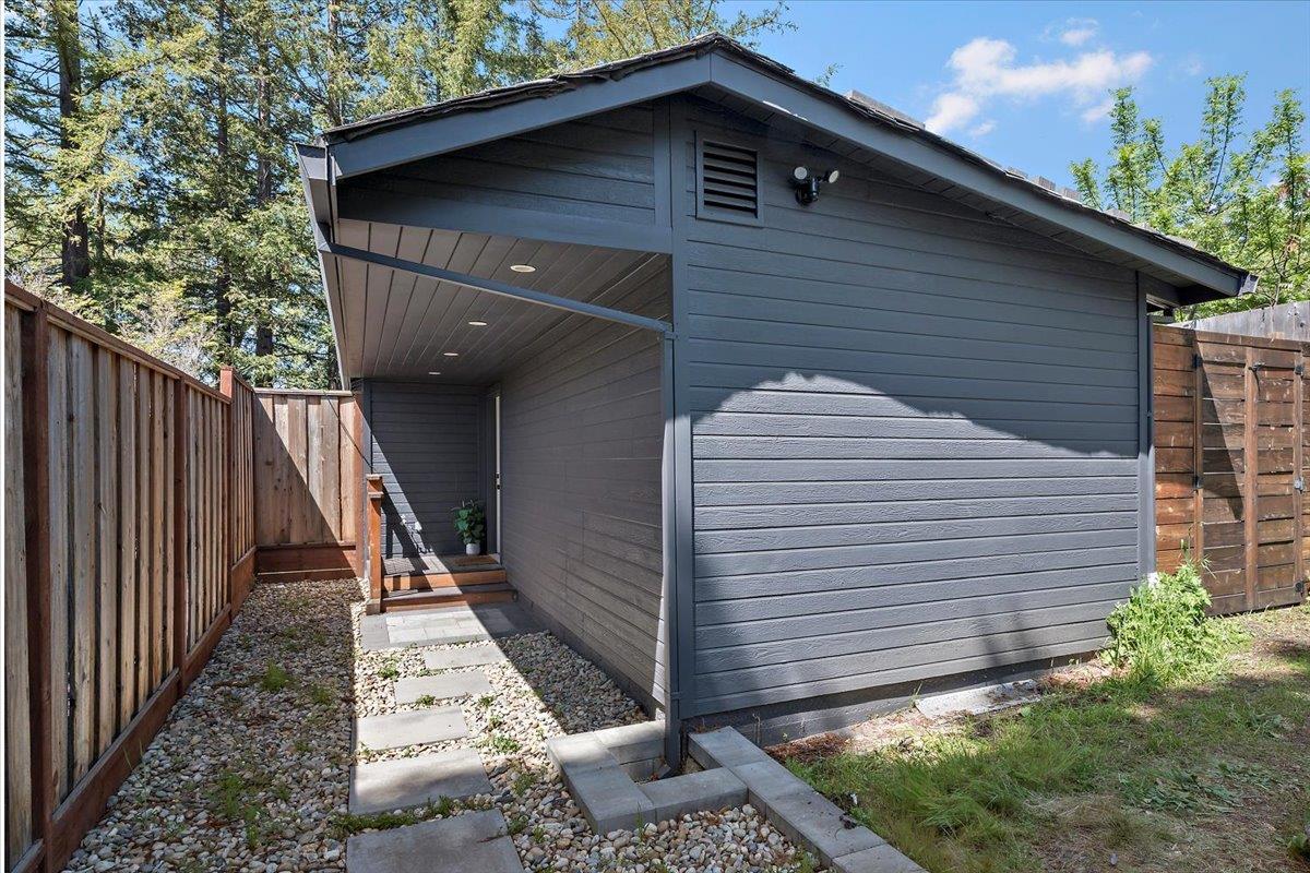 789 Cañada Road Woodside, CA 94062 - Photo 21 of 33 a front view of a house with a yard