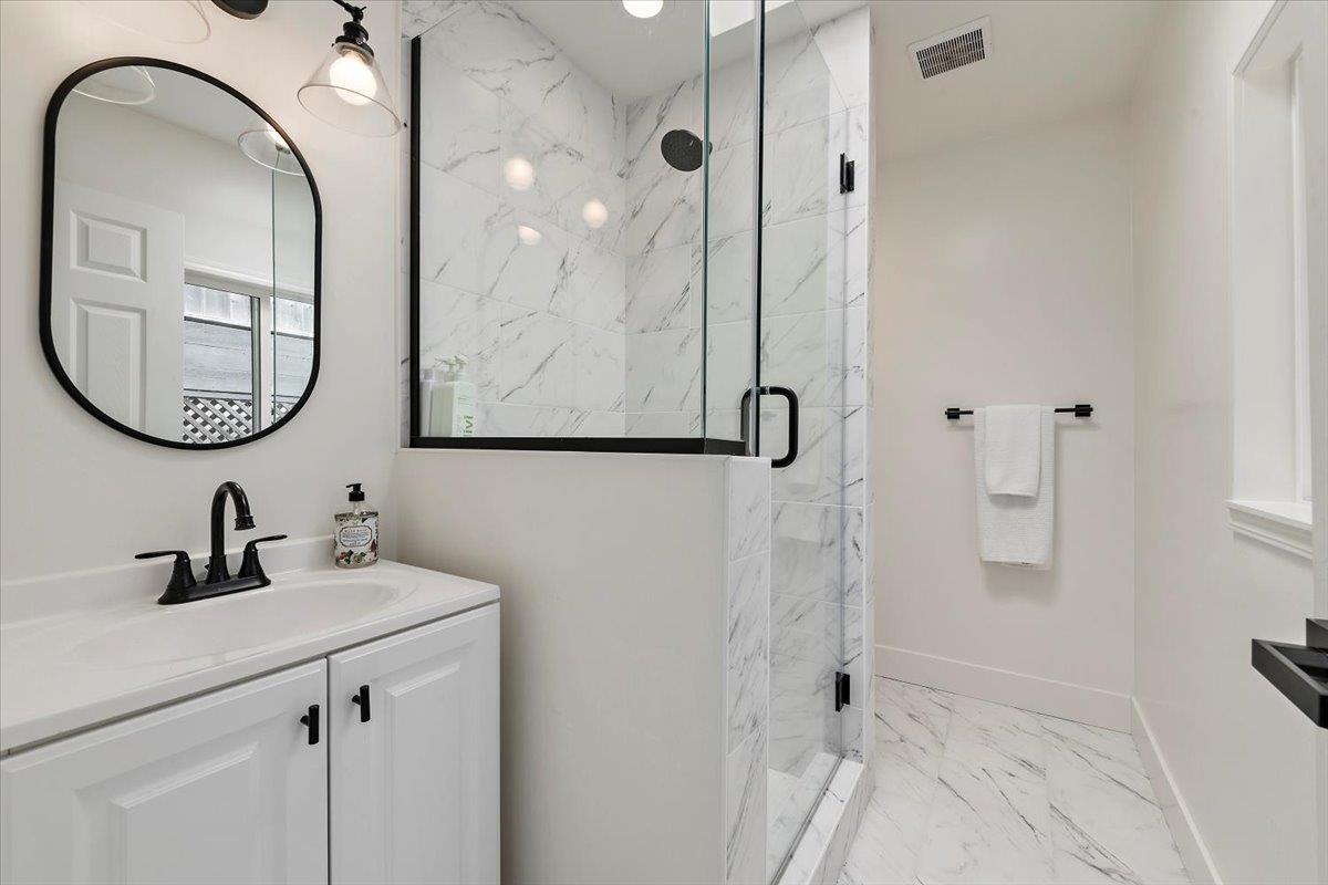 789 Cañada Road Woodside, CA 94062 - Photo 25 of 33 a bathroom with a sink and a mirror