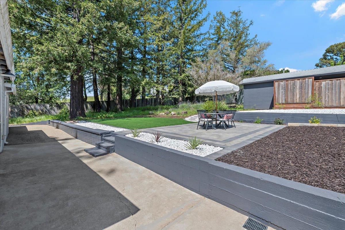 789 Cañada Road Woodside, CA 94062 - Photo 27 of 33 a view of a patio with a table and chairs