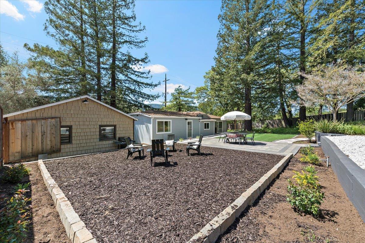 789 Cañada Road Woodside, CA 94062 - Photo 29 of 33 a backyard of a house with table and chairs