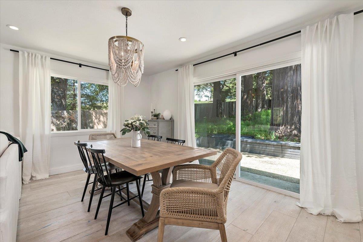 789 Cañada Road Woodside, CA 94062 - Photo 7 of 33 a view of a dining room with furniture window and wooden floor