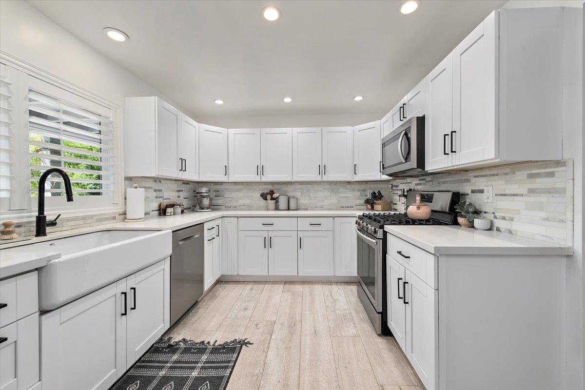 789 Cañada Road Woodside, CA 94062 - Photo 8 of 33 a kitchen with stainless steel appliances granite countertop a sink and cabinets