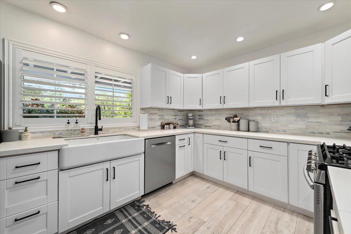 789 Cañada Road Woodside, CA 94062 - Photo 9 of 33 a kitchen with granite countertop white cabinets white appliances with a sink and dishwasher